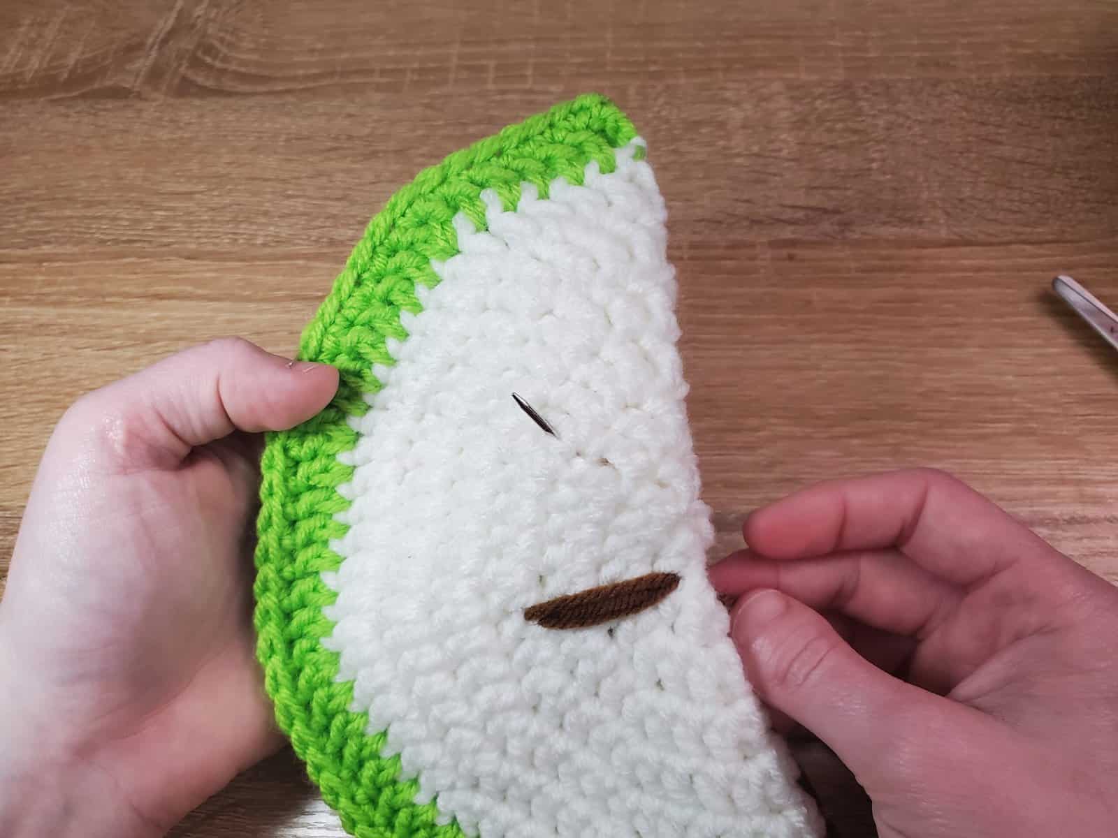 creating the other two stitches to form the seed