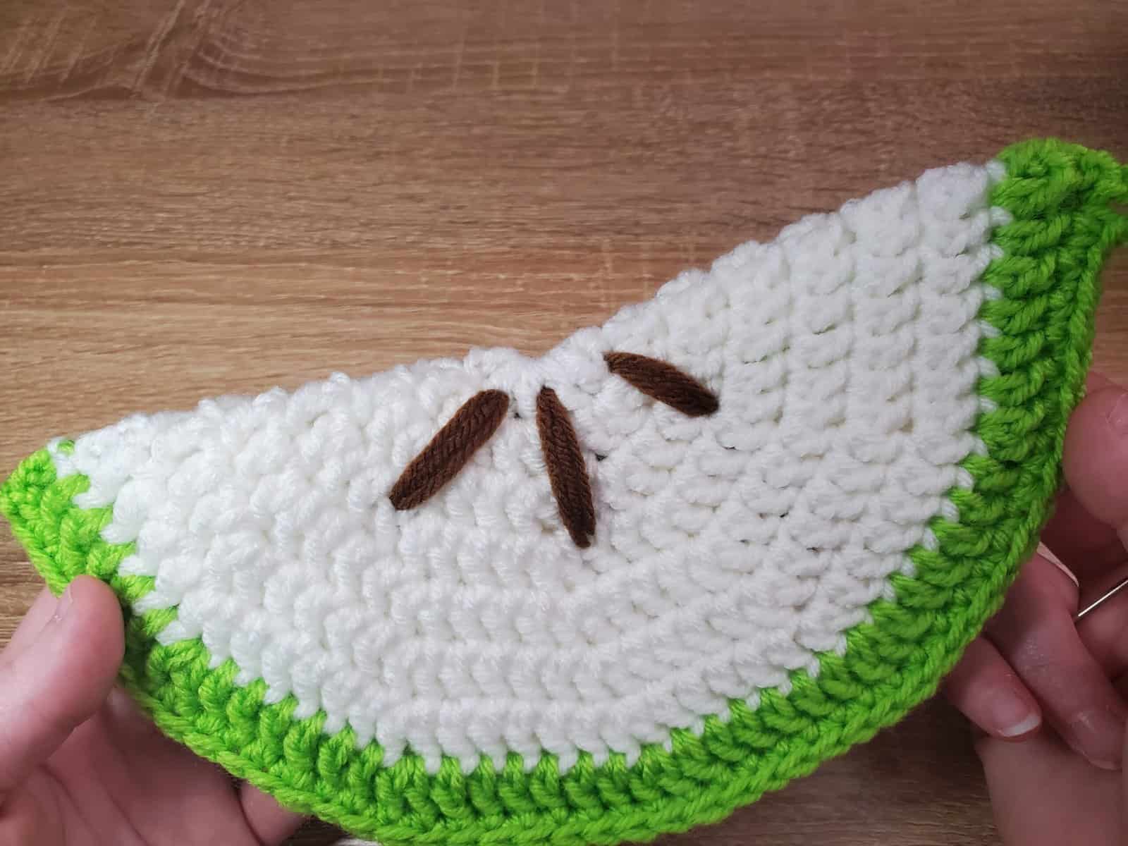 close up of the Crochet Fruit Potholders with seeds