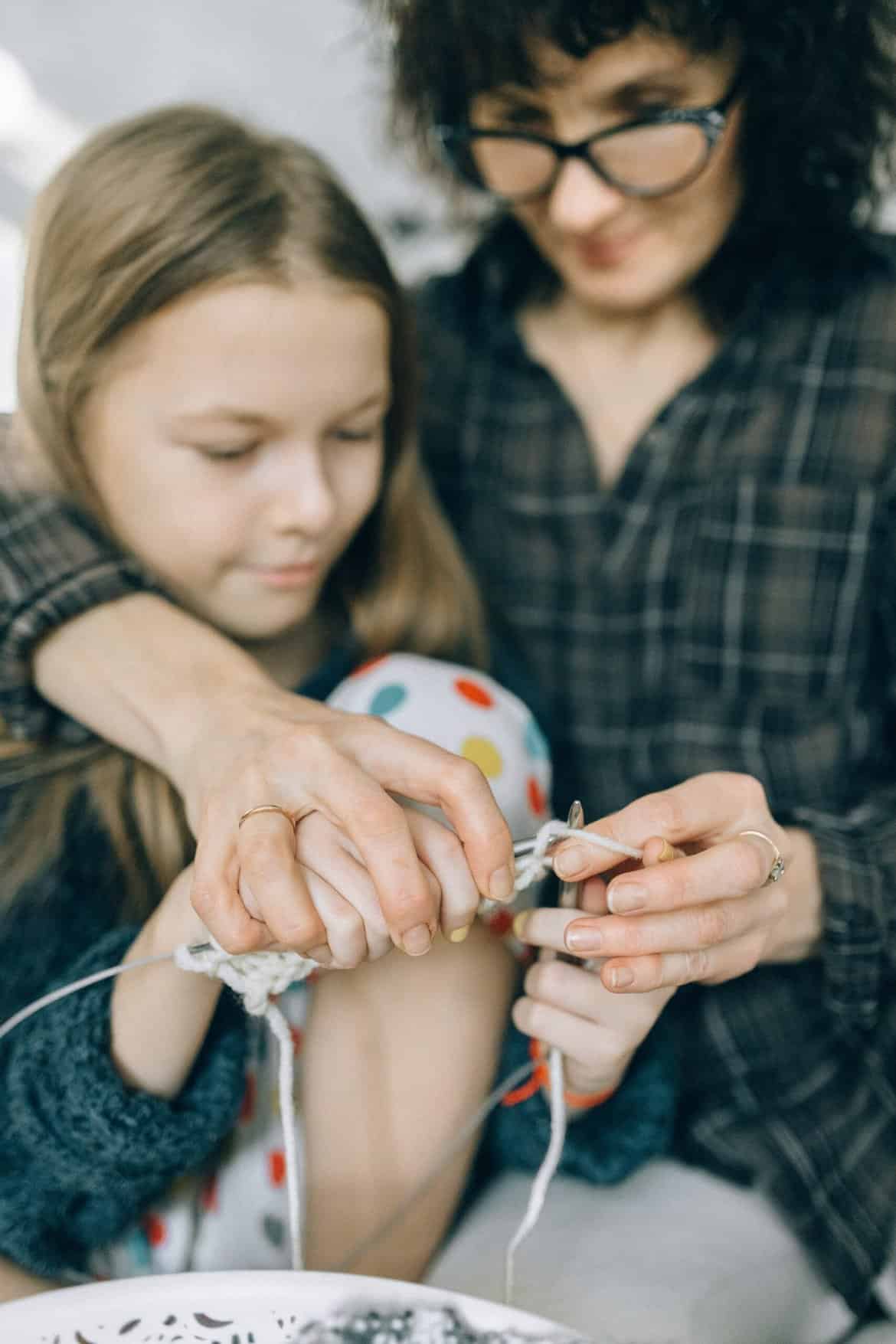 A Mother Showing Her Daughter How to Knit