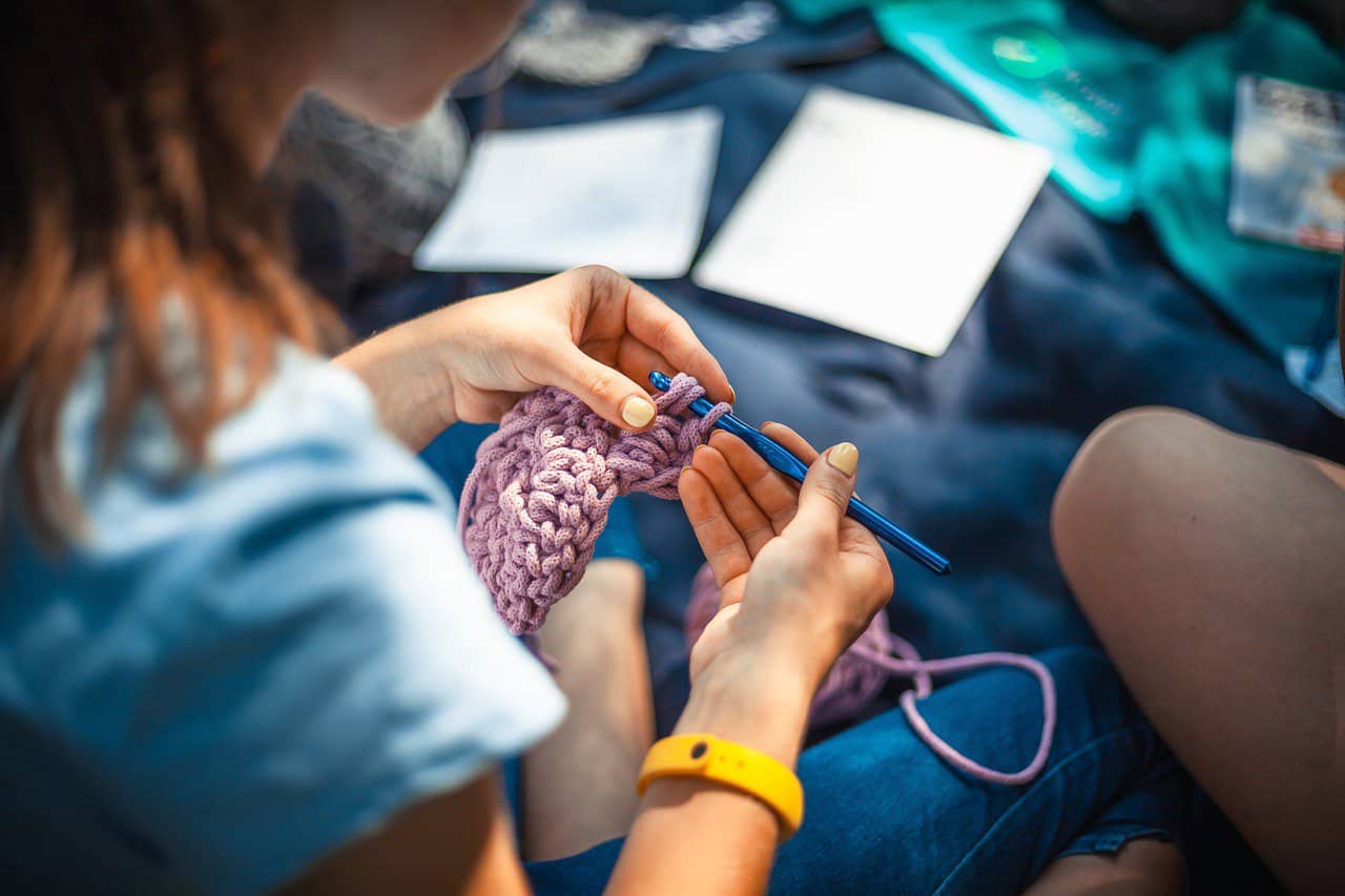 Closeup of a Young Woman Crocheting