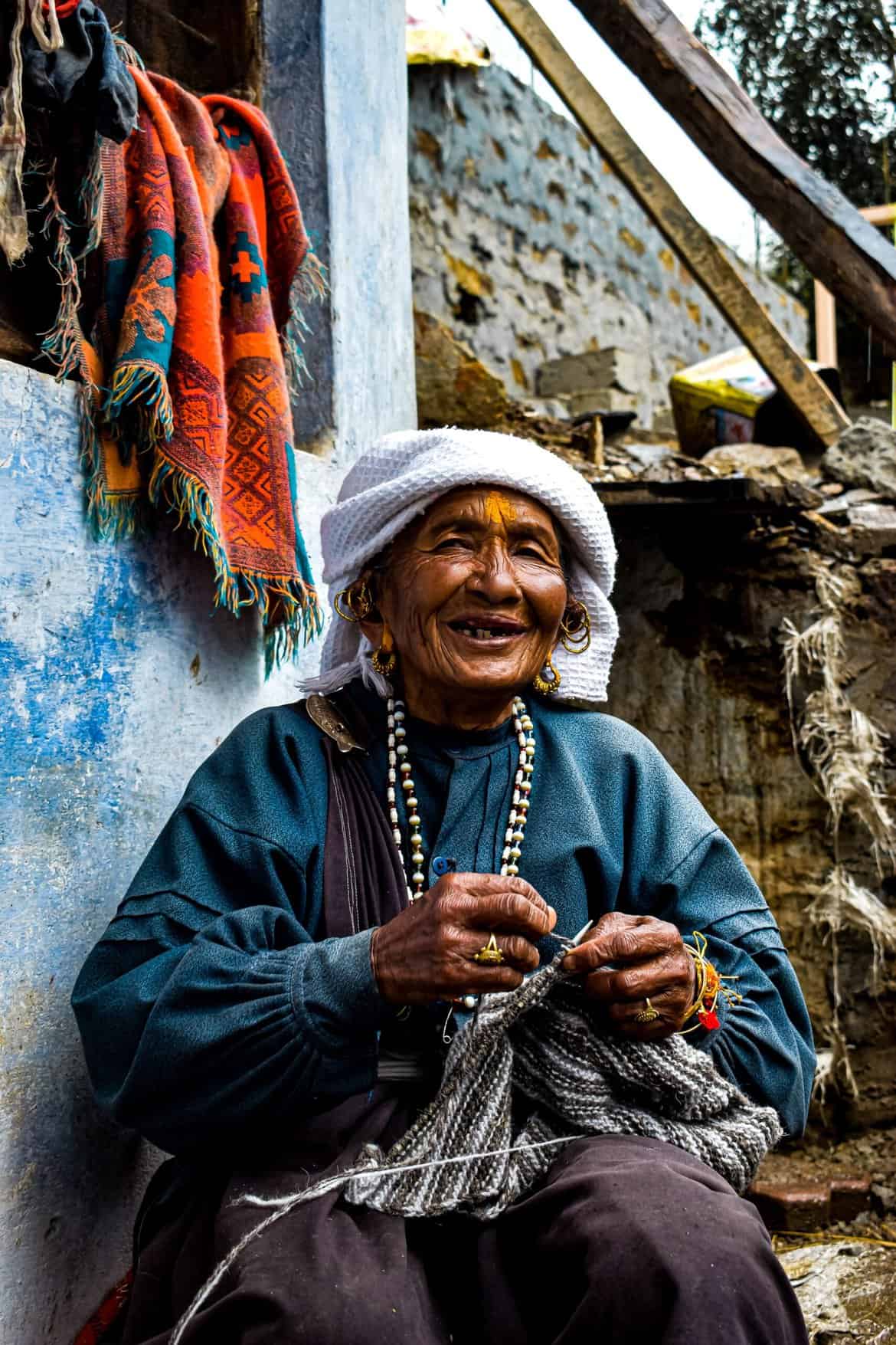 Elderly Woman Knitting a Garment