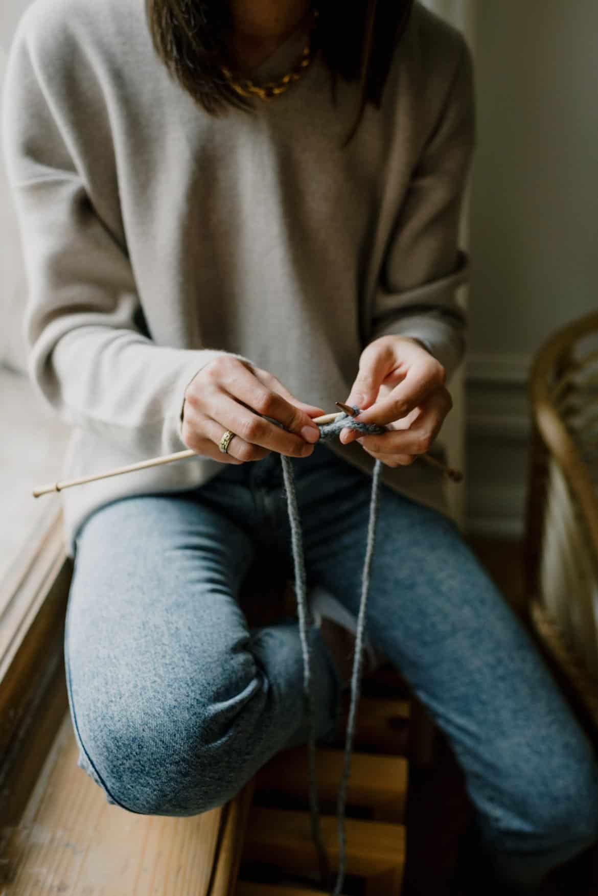 Woman Sitting by a Window Knitting
