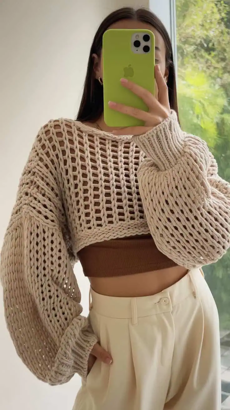 26 Cropped Sweater Crochet Patterns: Upgrade Your Wardrobe Handmade Style 42 a mirror selfie showing a chunky knit