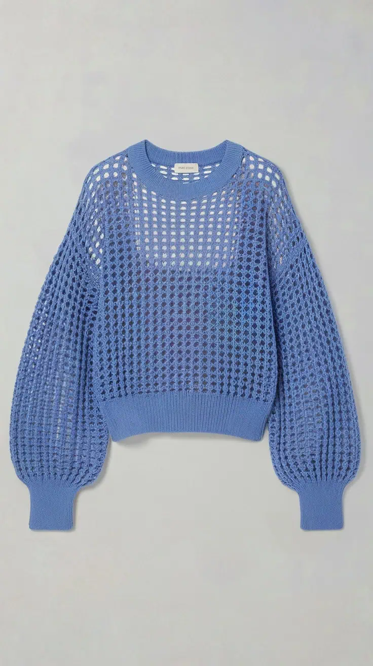 a photo of a blue woven sweater with a r k8KwjywqT