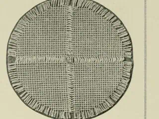 Halftone of a large woven centrepiece mat made from four square mats and one small centre mat